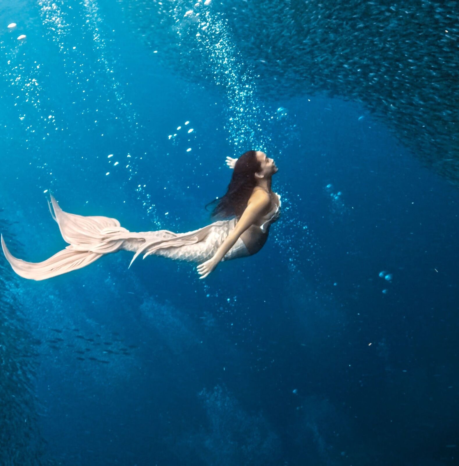 Mermaid Giona swimming gracefully underwater