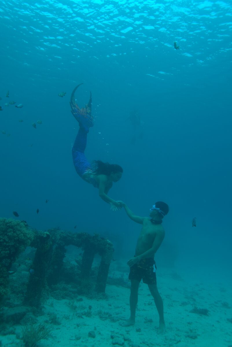 Mermaid Giona above a submerged structure